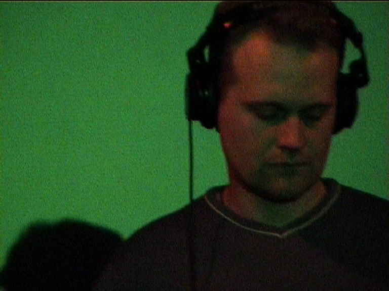 music producer adjusting sound levels on a console