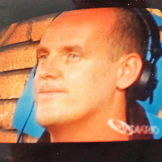 music producer adjusting sound levels on a console